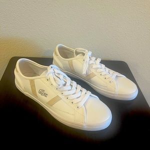 Lacoste Sideline lace up sneakers with
tan detail in white leather